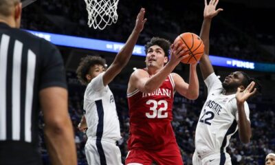 Hoosiers guard Trey Galloway (32) drives the ball to the basket as Penn State Nittany guard/forward Puff Johnson (4) and forward Qudus Wahab (22) defend.