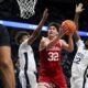 Hoosiers guard Trey Galloway (32) drives the ball to the basket as Penn State Nittany guard/forward Puff Johnson (4) and forward Qudus Wahab (22) defend.