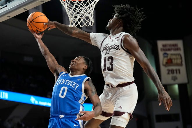 Texas A&M forward Solomon Washington (13) blocks a shot by Kentucky guard Rob Dillingham (0) during overtime of January's game in College Station, Texas. UK and Texas A&M play at 7 p.m. Friday in the SEC Tournament quarterfinals.