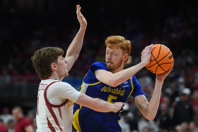 South Dakota State's forward Nate Barnhart (5) looks for an opening during the second half on Thursday, March 21, 2024 at the CHI Health Center in Omaha, Nebraska.