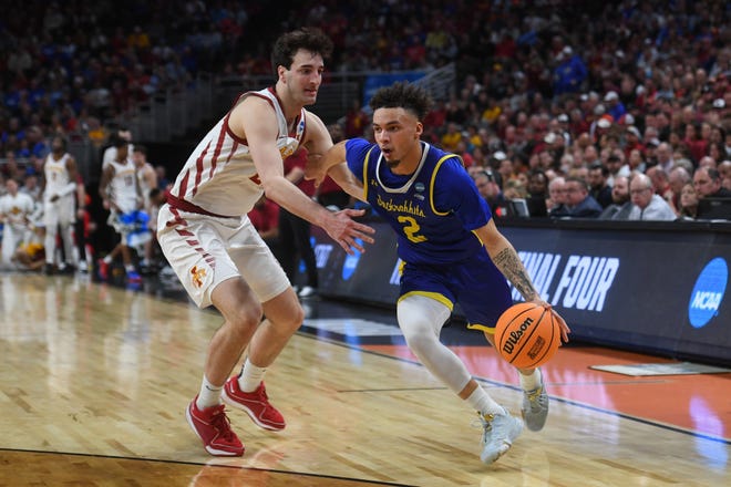 South Dakota State's guard Zeke Mayo (2) drives to the basket during the second half on Thursday, March 21, 2024 at the CHI Health Center in Omaha, Nebraska.