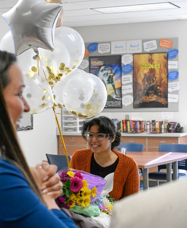 Stephanie Walker, Cedar Crest Vice President of Enrollment, left, congratulates...