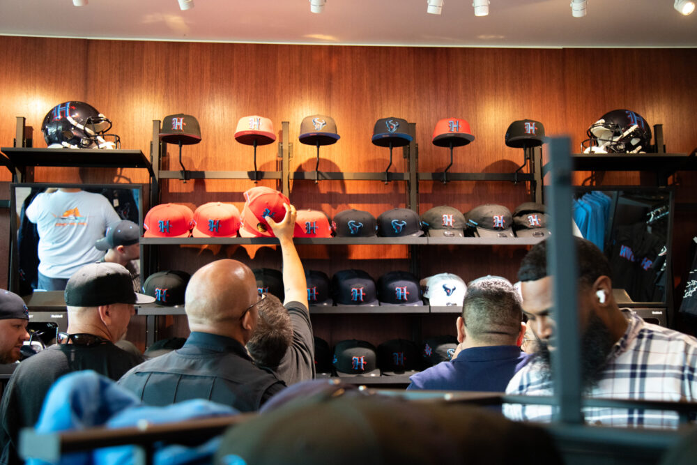 Houston Texans fans browse through the NRG fan shop in search for the perfect swag ahead of the season as the team unveils their new uniform on April 23, 2024. (Photo Credit: Daisy Espinoza / Houston Public Media)