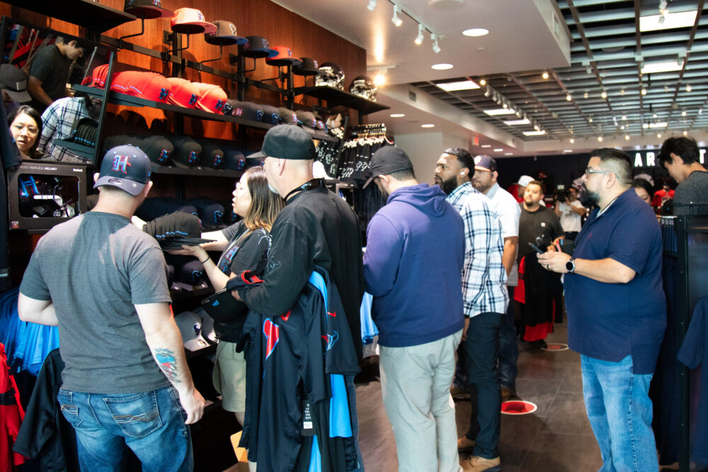 Houston Texans fans browse through the NRG fan shop in search for the perfect swag ahead of the season as the team unveils their new uniform on April 23, 2024. (Photo Credit: Daisy Espinoza / Houston Public Media)