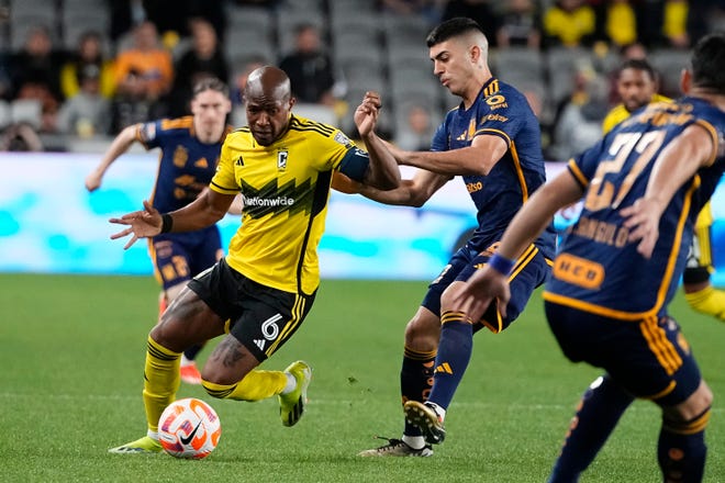 Apr 2, 2024; Columbus, OH, USA; Columbus Crew midfielder Darlington Nagbe (6) dribbles around Tigres UANL midfielder Juan Francisco Brunetta (11) during the first half of the Concacaf Champions Cup quarterfinal at Lower.com Field. Mandatory Credit: Adam Cairns-USA TODAY Sports