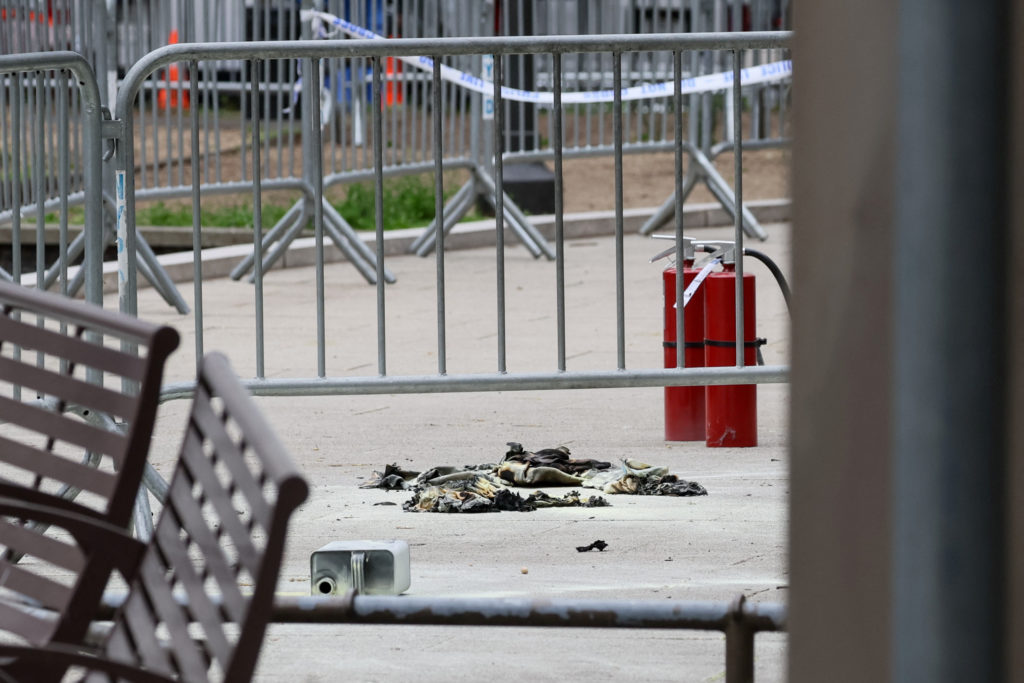 Aftermath of a person covered in flames outside NY courthouse of former U.S. President Trump's criminal hush money trial