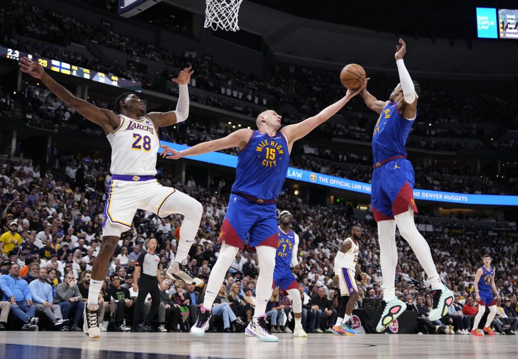 Nikola Jokic leads NBA champ Denver Nuggets past LeBron James and Lakers 114-103 in playoff opener