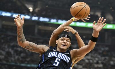 Orlando Magic's Paolo Banchero (5) fights for a rebound against Cleveland Cavaliers' Jarrett Allen during the first half in Game 1 of an NBA basketball first-round playoff series, Saturday, April 20, 2024, in Cleveland. (AP Photo/Nick Cammett)