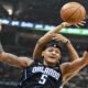 Orlando Magic's Paolo Banchero (5) fights for a rebound against Cleveland Cavaliers' Jarrett Allen during the first half in Game 1 of an NBA basketball first-round playoff series, Saturday, April 20, 2024, in Cleveland. (AP Photo/Nick Cammett)