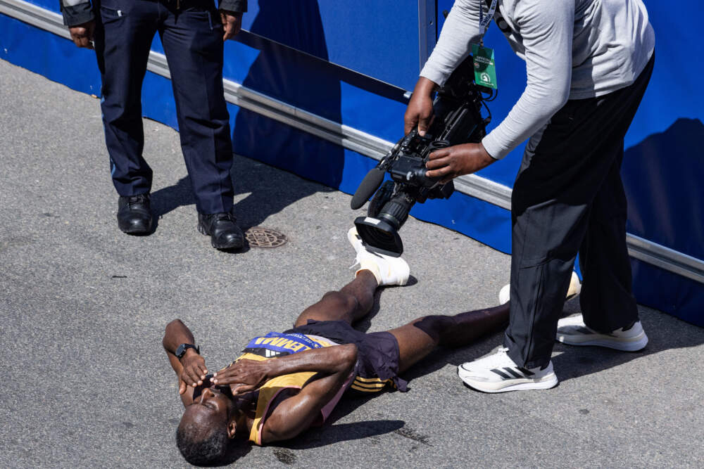 Sisay Lemma of Ethiopia celebrates taking first place in the men's professional field during the 128th Boston Marathon. (Joseph Prezioso / AFP via Getty Images)