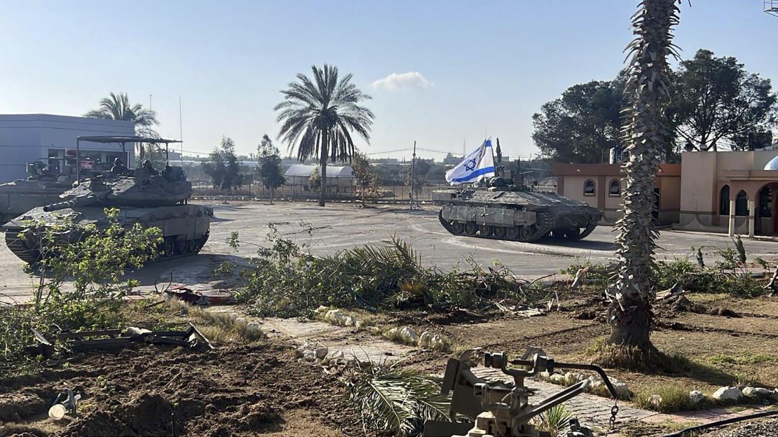 This photo provided by the Israel Defense Forces shows a tank with an Israel flag on it entering the Gazan side of the Rafah border crossing on Tuesday.