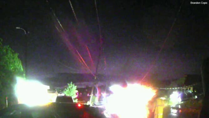 Damaged power lines are seen in Barnsdall, Oklahoma, after a tornado moved through May 6, 2024.