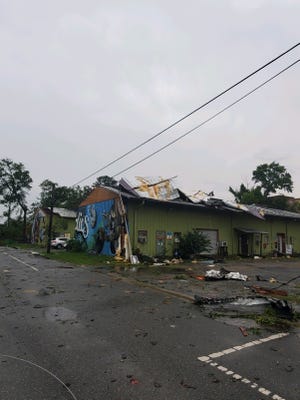 Major damage being seen in the Railroad Square Art District, including split trees and damage to structures.