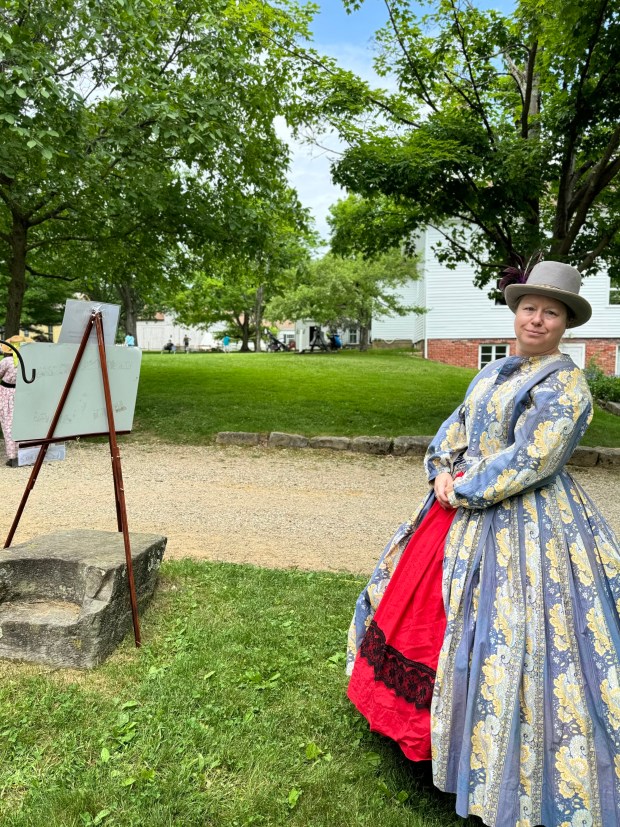 During Burton Century Village's Civil War Encampment event this weekend, Lane Smerglia decided to portray Miss Darcy Mae St. James, a madam of a brothel. (Marah Morrison -- The News-Herald)