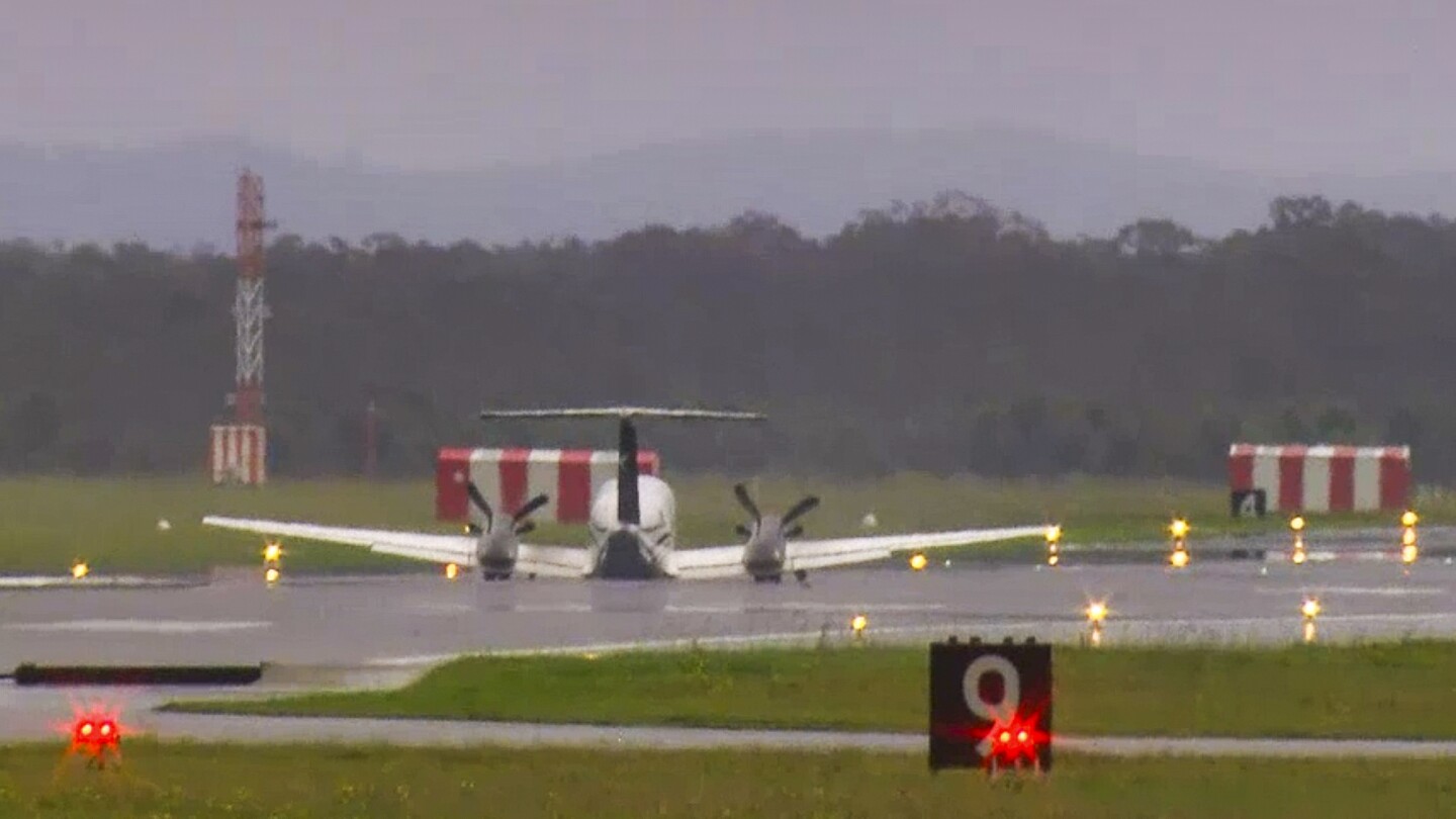 A plane with 3 aboard lands without landing gear at an Australian airport after burning off fuel