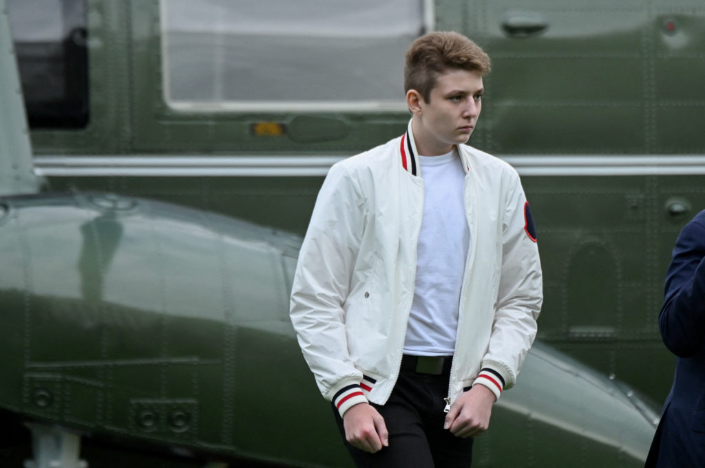 FILE PHOTO: Barron Trump walks to the White House from Marine One in Washington, U.S. August 16, 2020. Photo by Erin Scott...