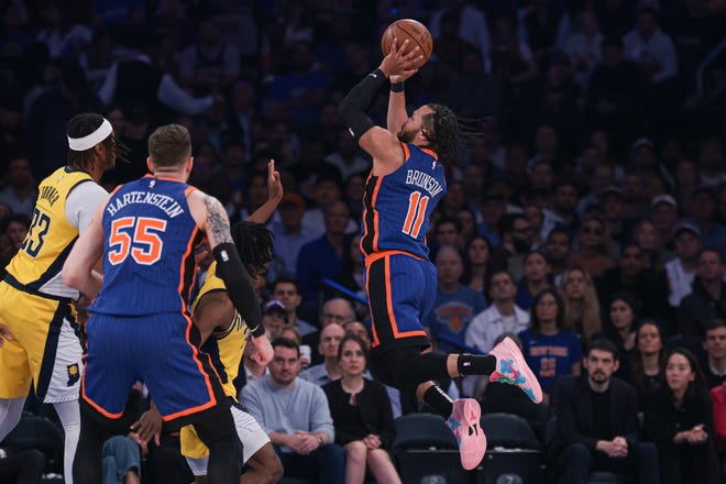 May 14, 2024; New York, New York, USA; New York Knicks guard Jalen Brunson (11) drives for a shot in front of Indiana Pacers center Myles Turner (33) and center Isaiah Hartenstein (55) during game five of the second round for the 2024 NBA playoffs at Madison Square Garden. Mandatory Credit: Vincent Carchietta-USA TODAY Sports