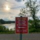 Metroparks Police posted this sign in Kensington on Thursday, May 16, 2024, warning of a possible alligator in the lake.