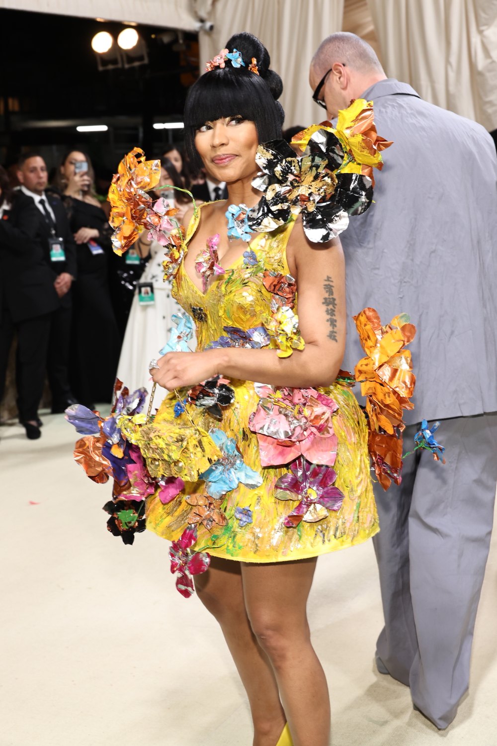 Nicki Minaj Puts On a Quirky Display in Canary Yellow Floral Appliqué Dress at the 2024 Met Gala