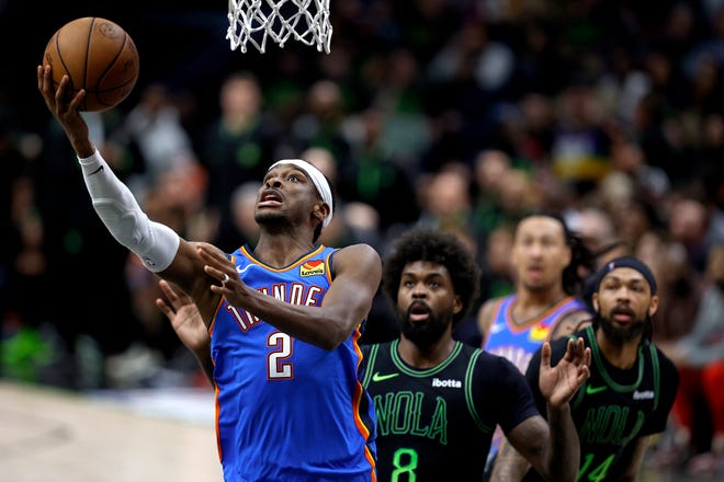 NEW ORLEANS, LOUISIANA - APRIL 29: Shai Gilgeous-Alexander #2 of the Oklahoma City Thunder goes to the basket as Naji Marshall #8 of the New Orleans Pelicans looks on during the second quarter in Game Four of the first round of the 2024 NBA Playoffs at Smoothie King Center on April 27, 2024 in New Orleans, Louisiana.