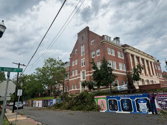 Downed trees and debris at Florida A&M University are currently being removed by cleanup crews. Trees and power lines are down around the campus after storm on Friday, May 10, 2024.