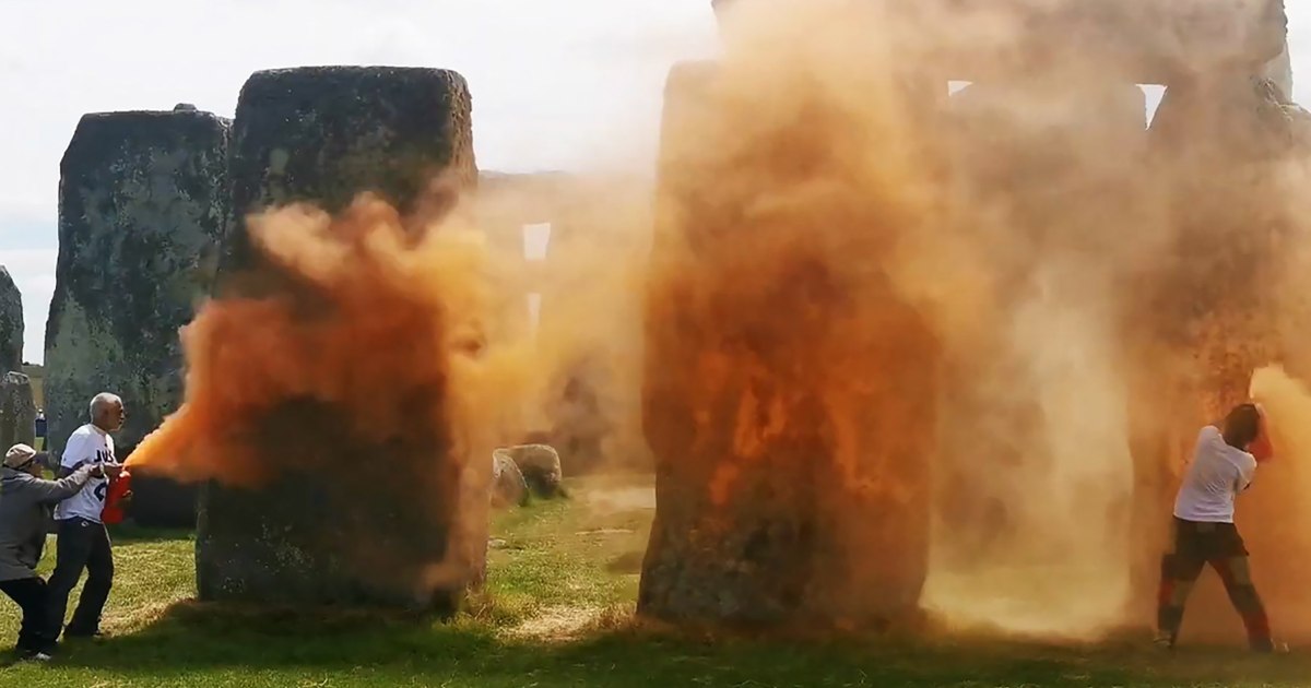 Stonehenge sprayed orange by climate protesters