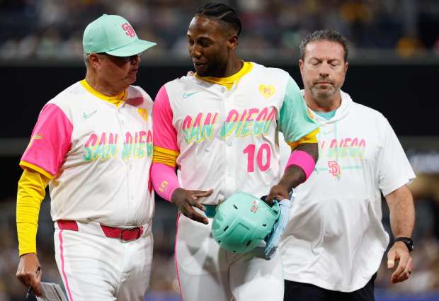 Padres manager Mike Shildt (8) walks with left fielder Jurickson Profar (10) during the seventh inning. (Meg McLaughlin / The San Diego Union-Tribune)