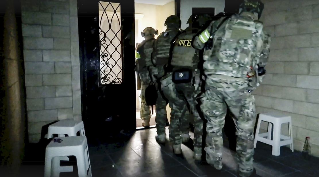 Russian security personnel conduct a counter-terrorist operation in Dagestan in a video screengrab released by the National Antiterrorism Committee on June 24, 2024.