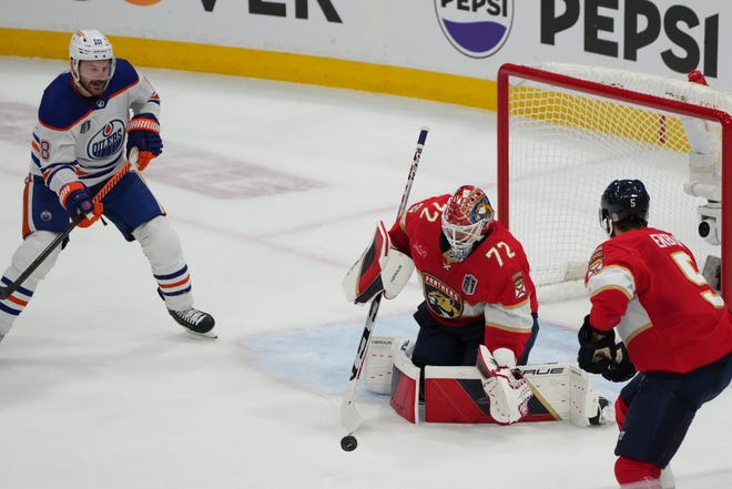 Jun 8, 2024; Sunrise, Florida, USA; Florida Panthers goaltender Sergei Bobrovsky (72) and defenseman Aaron Ekblad (5) defend against Edmonton Oilers forward Zach Hyman (18) during the first period in game one of the 2024 Stanley Cup Final at Amerant Bank Arena. Mandatory Credit: Jim Rassol-USA TODAY Sports