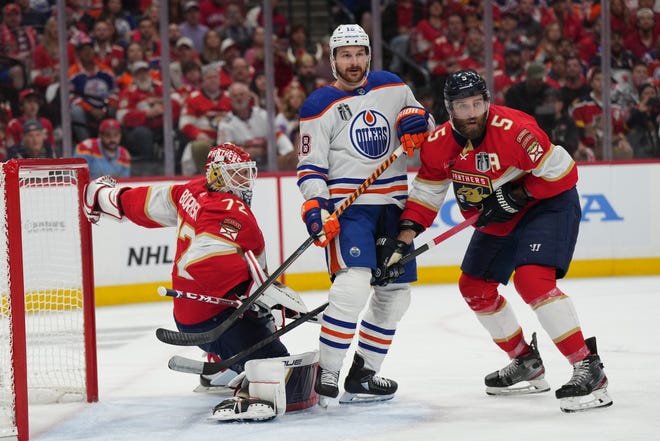 Jun 10, 2024; Sunrise, Florida, USA; Florida Panthers goaltender Sergei Bobrovsky (72) and defenseman Aaron Ekblad (5) defend against Edmonton Oilers forward Zach Hyman (18) during the first period in game two of the 2024 Stanley Cup Final at Amerant Bank Arena. Mandatory Credit: Jim Rassol-USA TODAY Sports