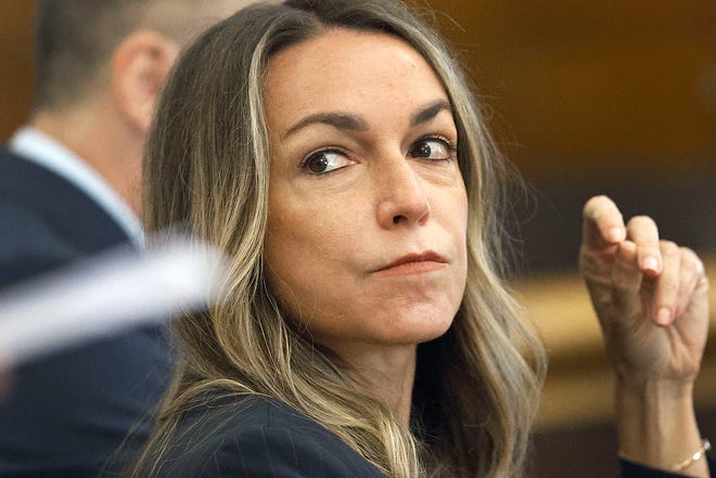 Karen Read listens to her lawyer Alan Jackson question Massachusetts State Trooper Michael Proctor during her trial on murder charges in Norfolk Superior Court in Dedham on Wednesday, June 12, 2024.