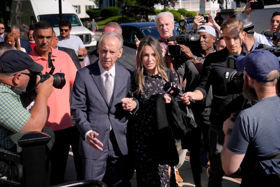 Karen Read, center, arrives at Norfolk Superior Court with her father William Read, Tuesday,...