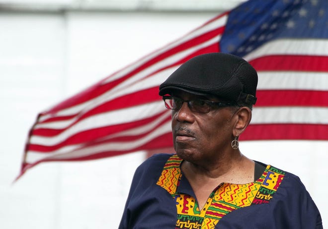 Hugh Holmes Jr., originally of Bridgewater and now of Fall River, listens to the speakers from Bridgewater-Raynham Regional High School during the Juneteenth flag raising ceremony in downtown Bridgewater on Monday, June 17, 2024.