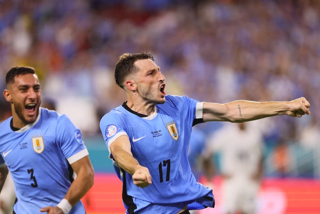 Jun 23, 2024; Miami, FL, USA; Uruguay defender Matias Vina (17) celebrates after scoring against Panama in the second half during the group stage of Copa America at Hard Rock Stadium. Mandatory Credit: Sam Navarro-USA TODAY Sports