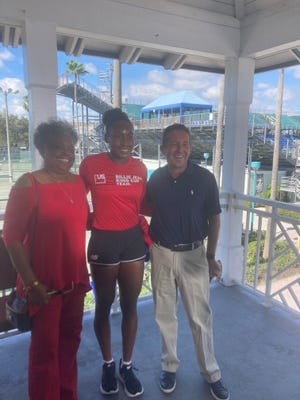 Coco Gauff, flanked by her grandma ,Yvonne Odom, and Delray Beach Vice Mayor Adam Frankel, pose Friday in Delray Beach.