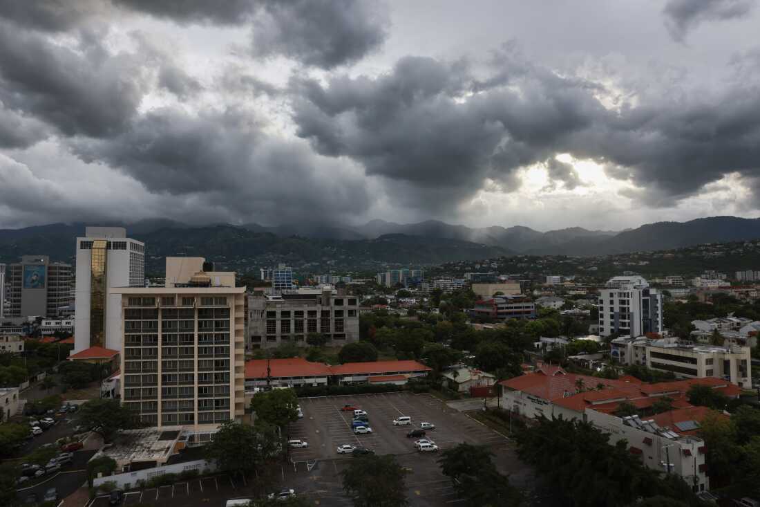 Storm clouds hover over the mountains in Jamaica.