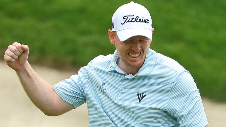 Hayden Springer of the United States reacts after a birdie putt on the 18th hole for a score of 59 in the first round of the John Deere Classic