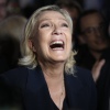 French far right leader Marine Le Pen reacts as she meets supporters and journalists after the release of projections based on the actual vote count in select constituencies on Sunday in Henin-Beaumont, northern France.