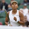 Naomi Osaka of Japan reacts after winning a point against Diane Parry of France during their first round match of the Wimbledon tennis championships in London, Monday, July 1, 2024. (AP Photo/Kirsty Wigglesworth)