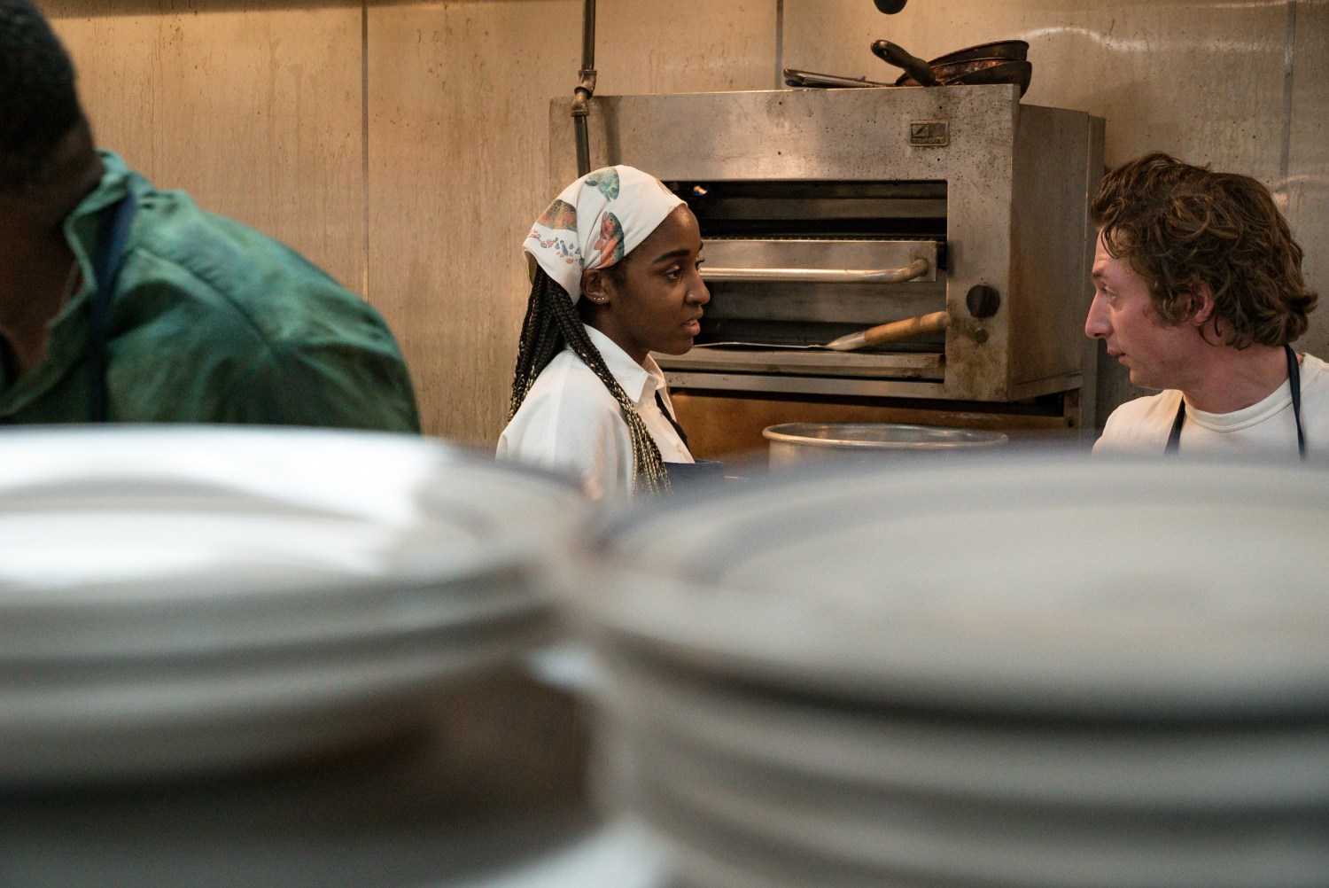 Ayo Edebiri and Jeremy Allen White in season one episode Brigade.