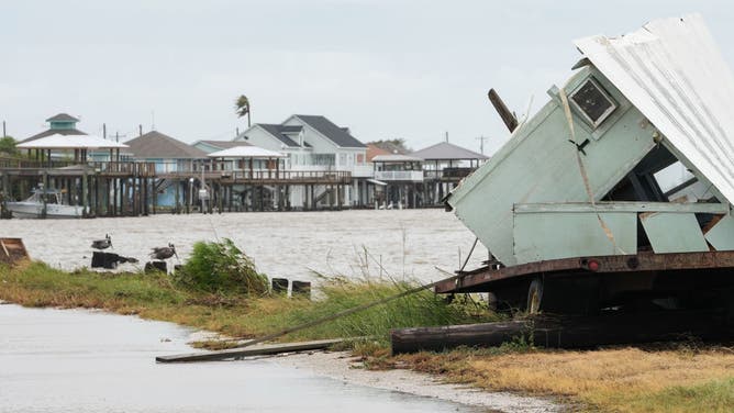 A destroyed trailer sits near beach homes after Hurricane Beryl came ashore nearby Monday, July 8, 2024, in Matagorda.