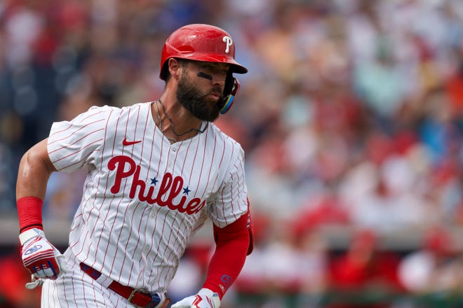 Philadelphia Phillies second baseman Weston Wilson (37) runs to first on a base hit against the Toronto Blue Jays in the second inning at BayCare Ballpark in a spring-training game.