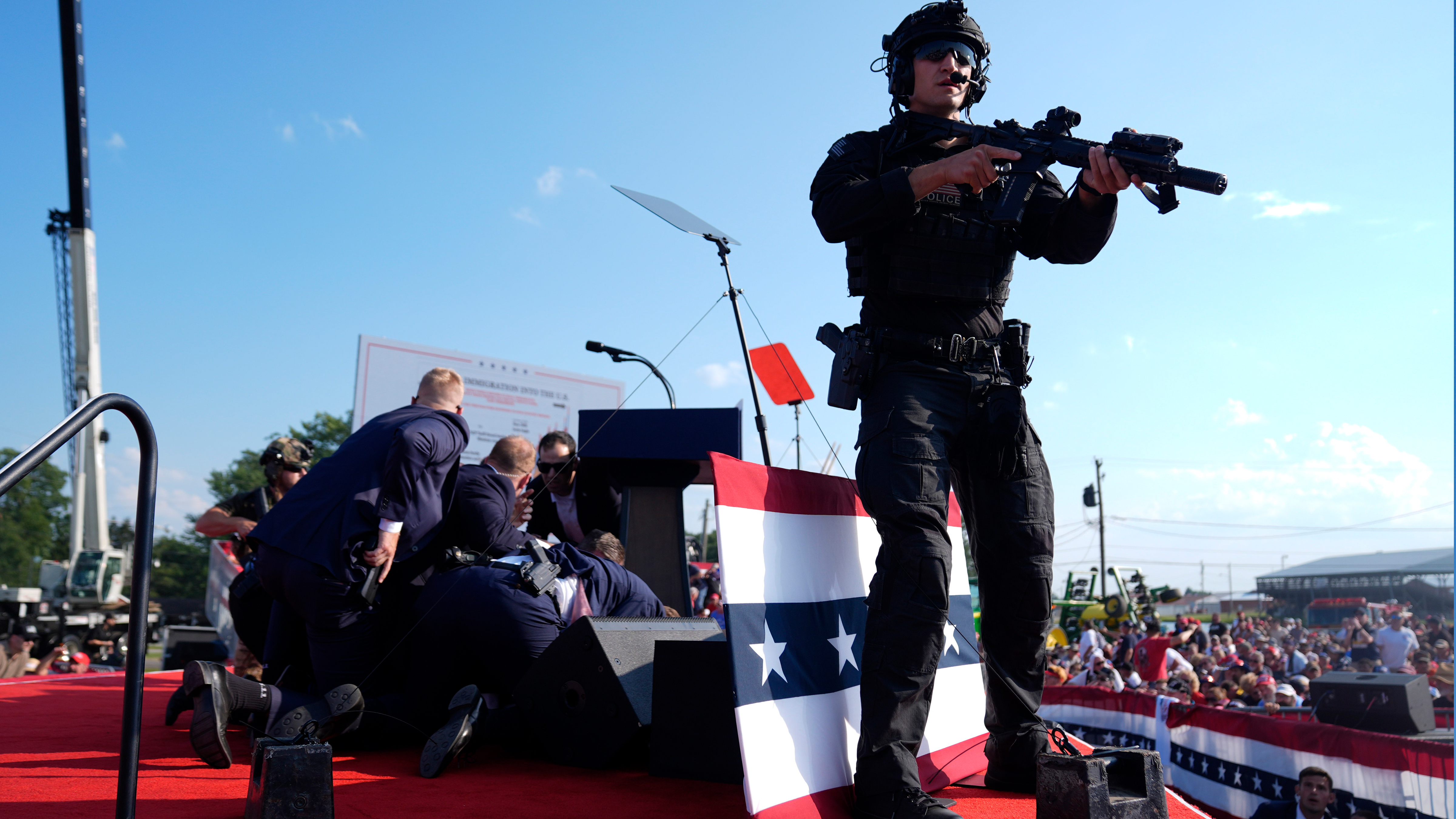 Republican presidential candidate former President Donald Trump is covered by U.S. Secret Service agents at a campaign rally, Saturday, July 13, 2024, in Butler, Pa.