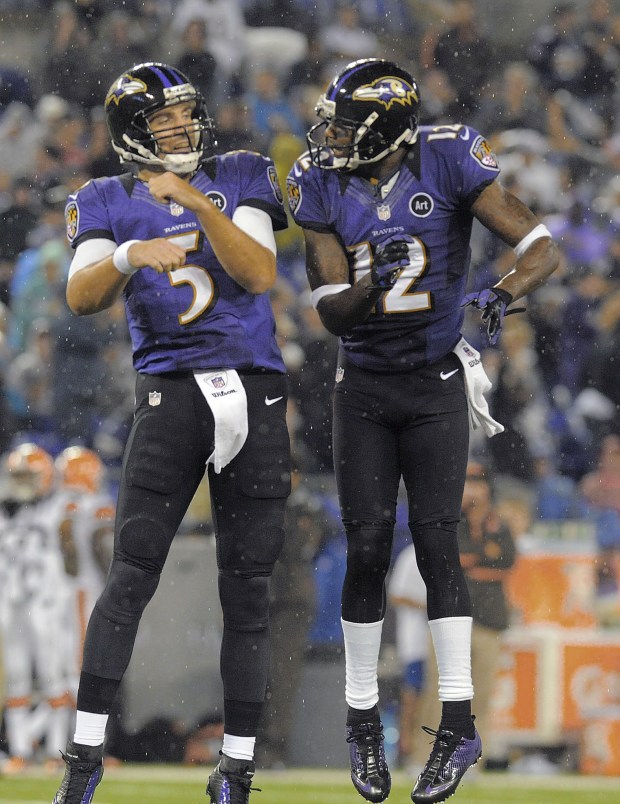 Ravens quarterback Joe Flacco, left, and wide receiver Jacoby Jones...