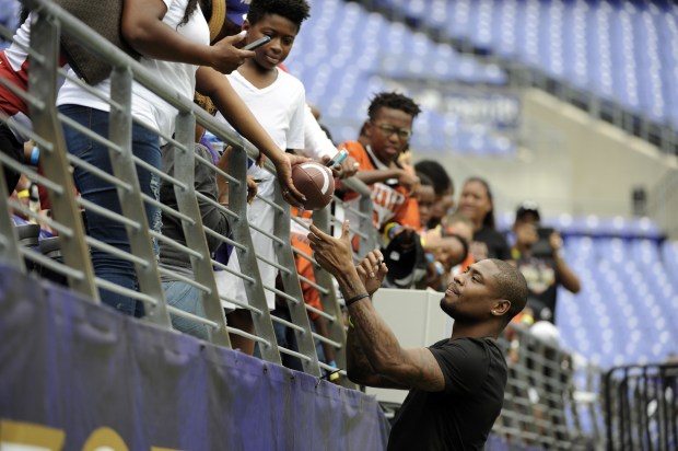 Baltimore, Md--8/12/17--Former Ravens wide receiver/returner Jacoby Jones signs autographs during...