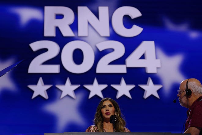 South Dakota Governor Kristi Noem stands at the podium onstage ahead of the Republican National Convention in Milwaukee, Wisconsin on July 14, 2024.