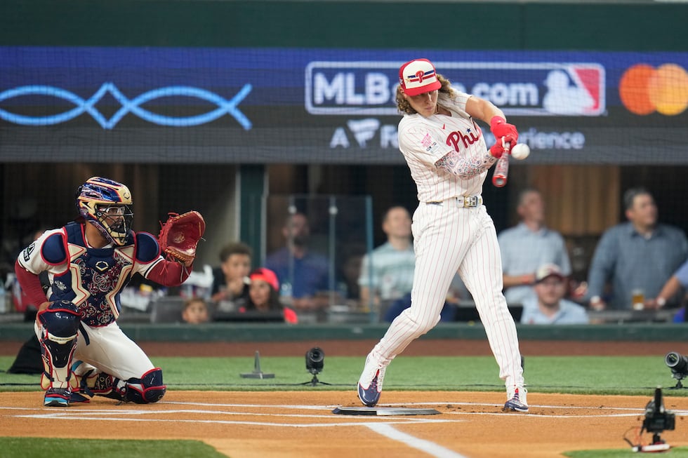 National League's Alec Bohm, of the Philadelphia Phillies, connects during the MLB baseball...