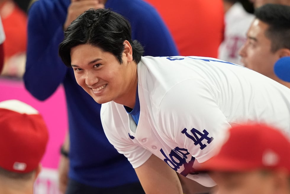 National League's Shohei Ohtani, of the Los Angeles Dodgers, smiles during the MLB baseball...