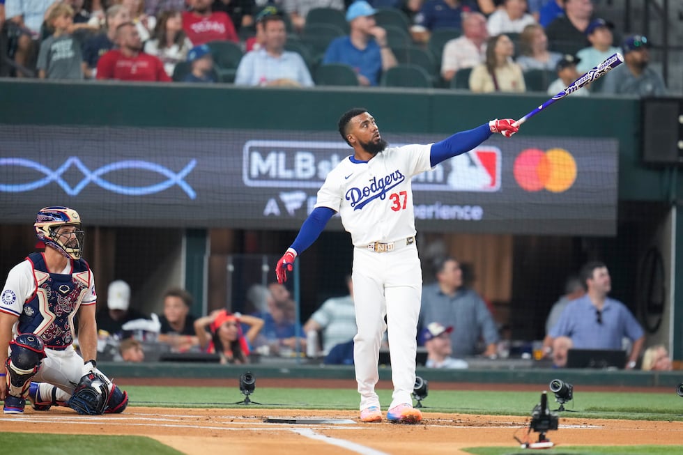 National League's Teoscar Hernandez, of the Los Angeles Dodgers, connects during the MLB...