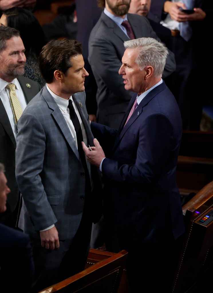 U.S. House Republican Leader Kevin McCarthy conversing with Rep.-elect Matt Gaetz on the House Chamber floor during Speaker of the House elections